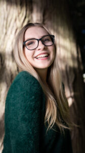 woman wearing glasses smiling