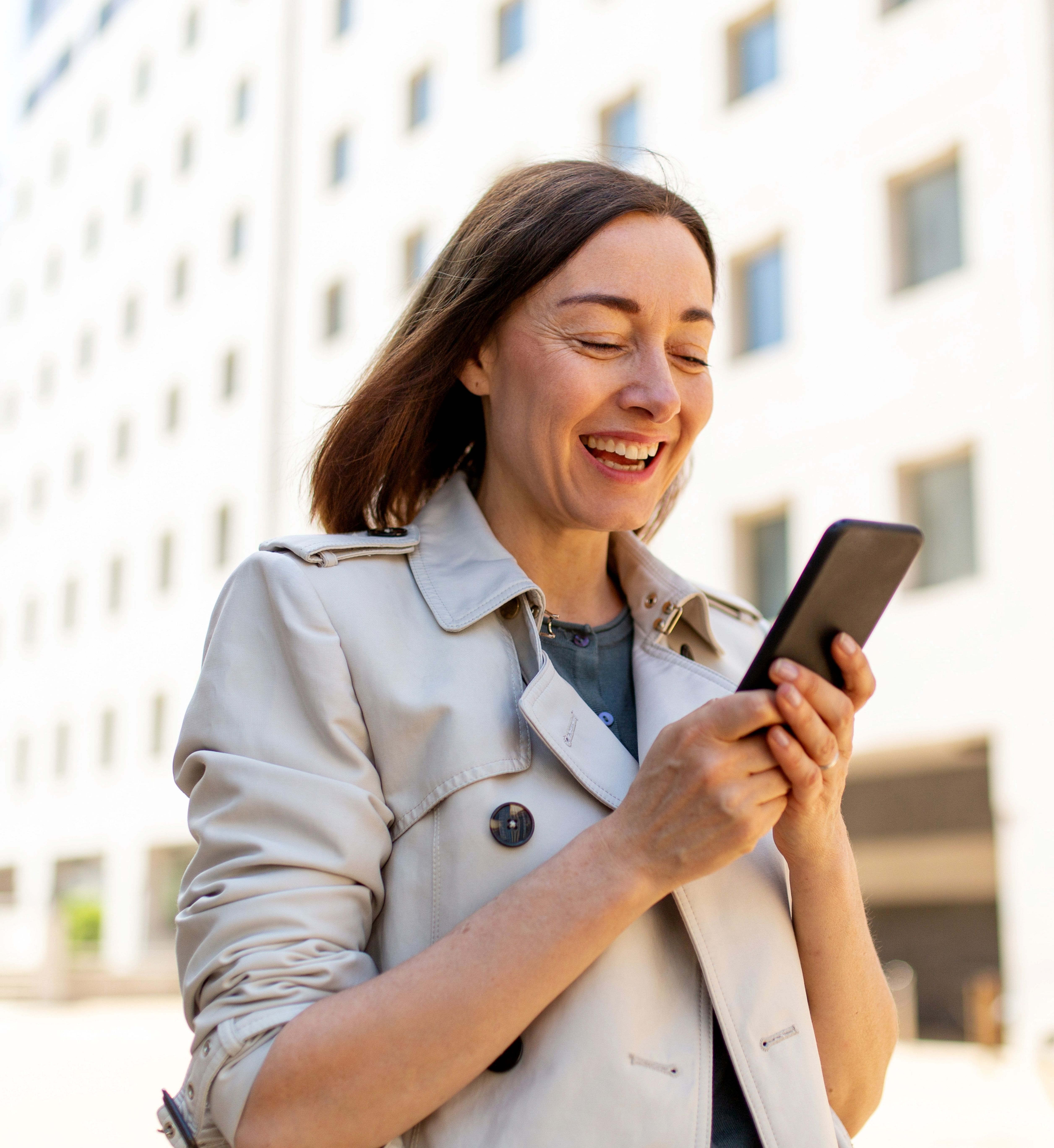 happy woman looking at phone RLE